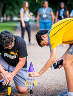 Students building a rocket