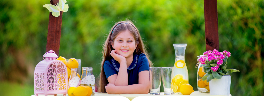 Little girl running a lemonade stand